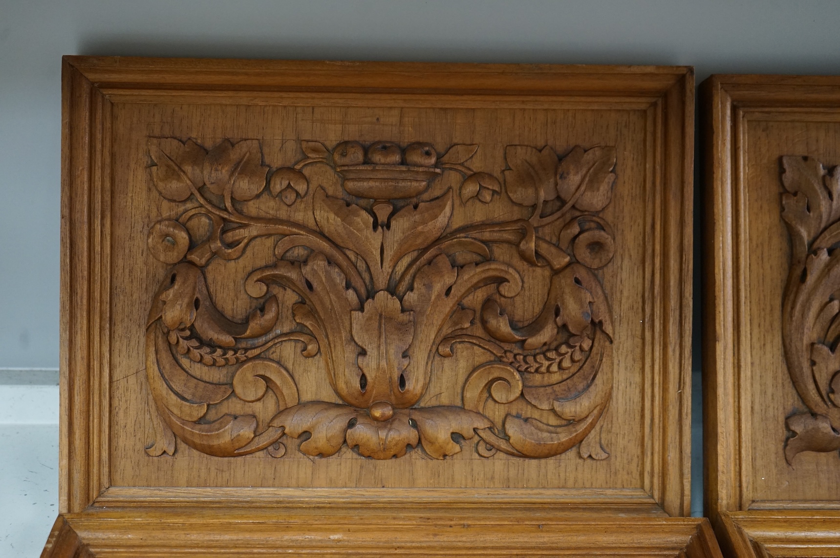 Six carved wood relief plaques, largest 31x46cm